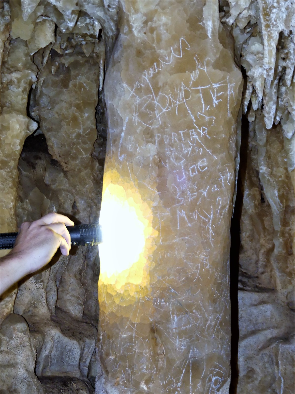 glowing column with graffiti