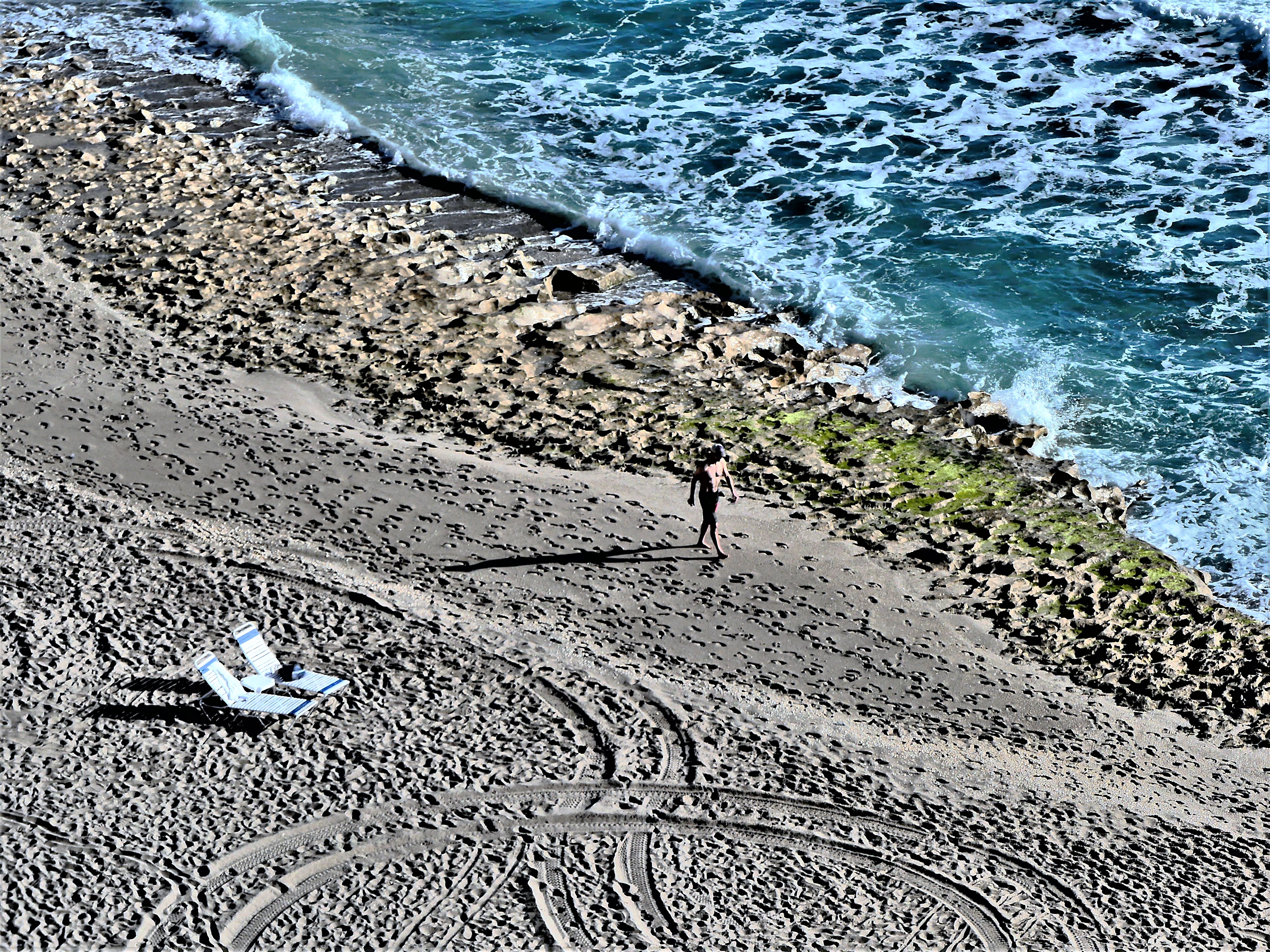 2 lounge chairs and a walker