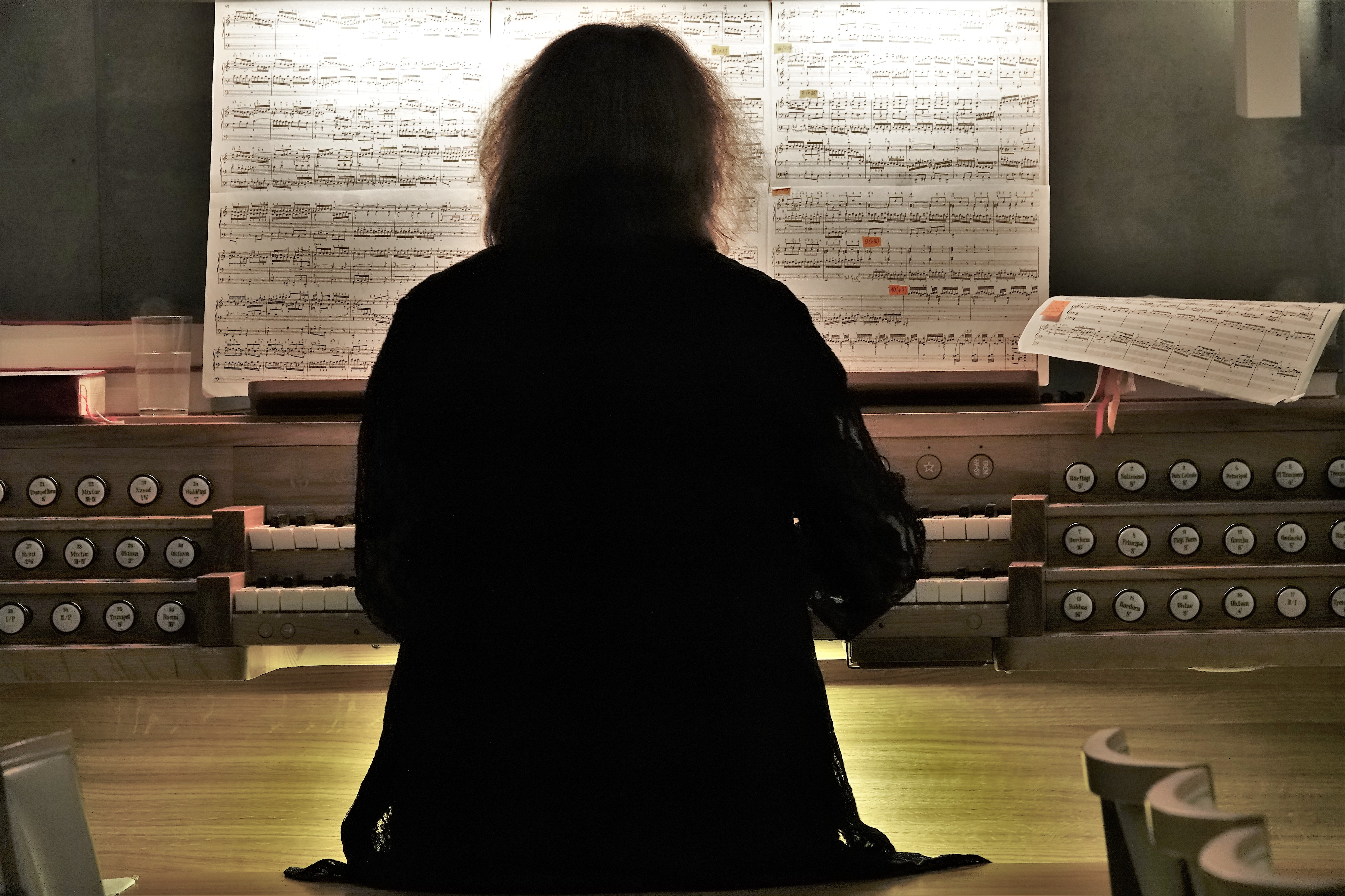 organ performance with sheet music