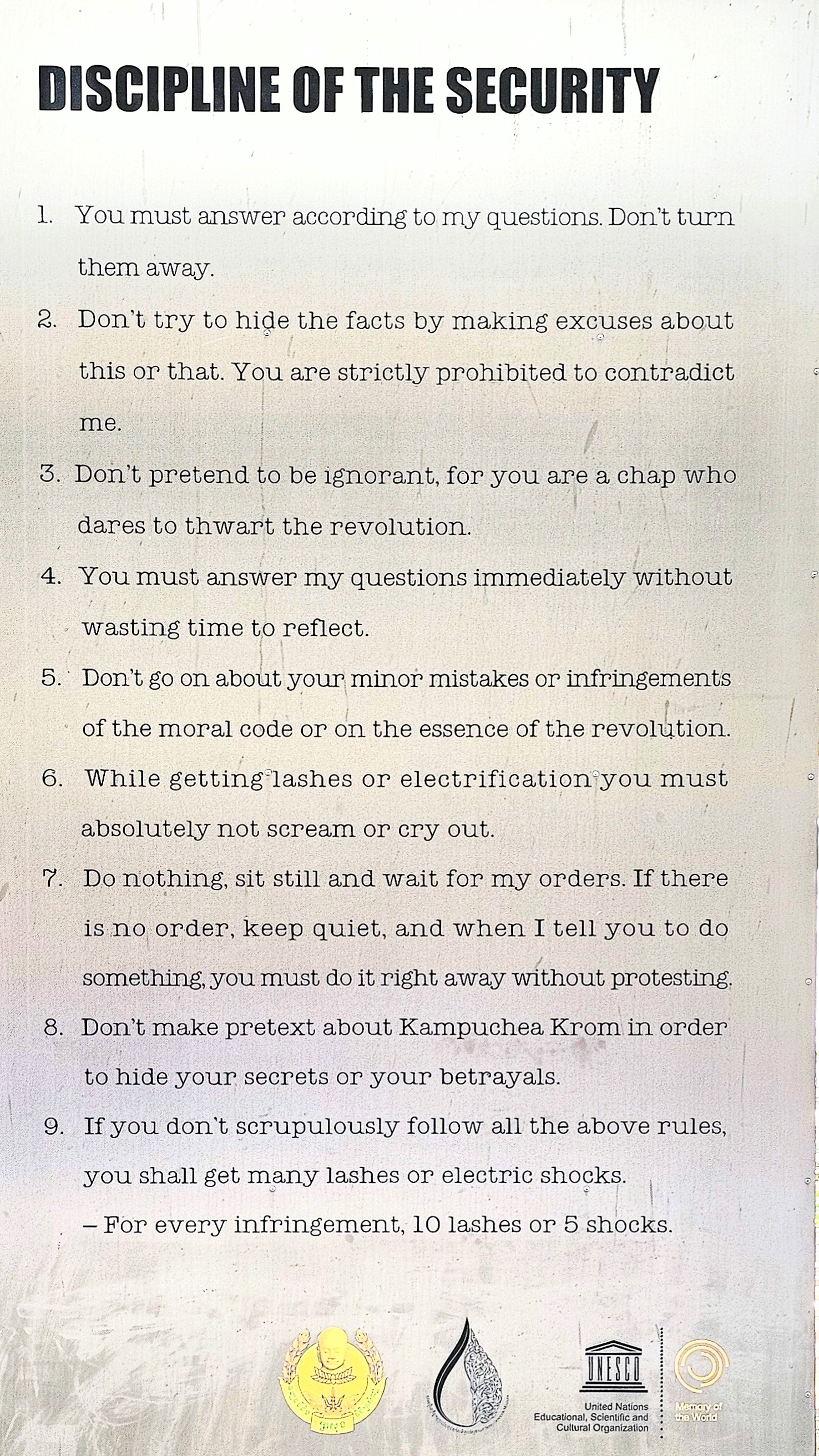 A poster detailing the rules of conduct and discipline for detainees, with numbered instructions emphasizing strict compliance and the severe consequences for disobedience.